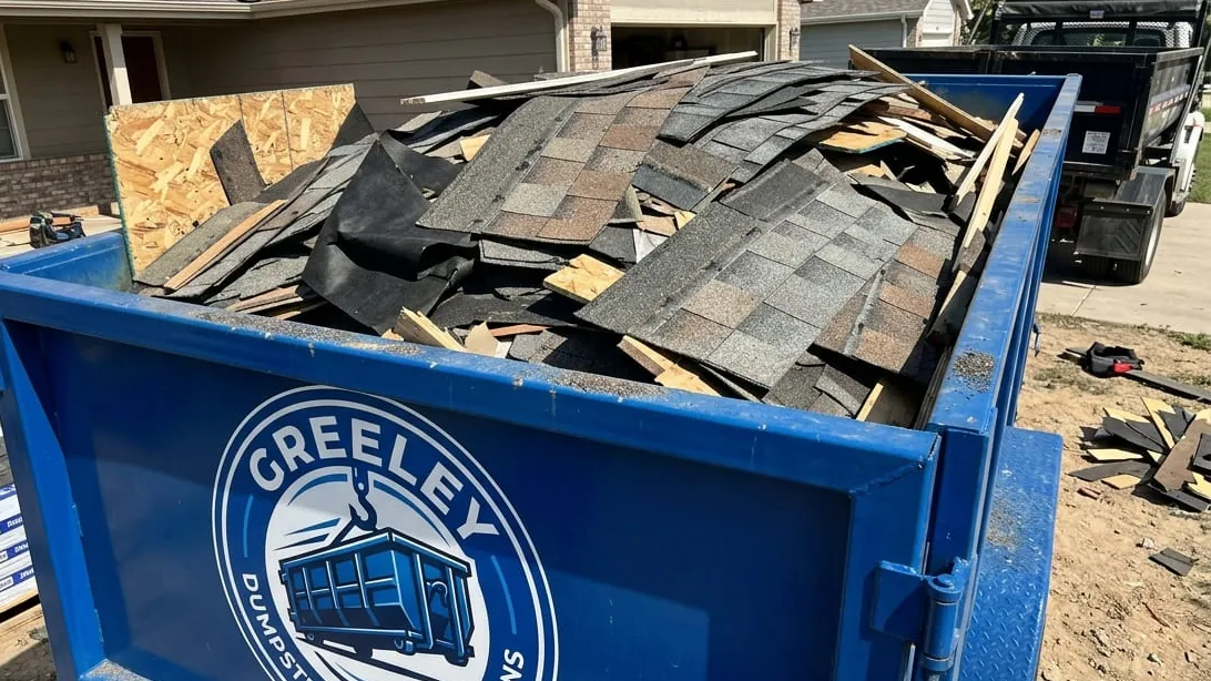Hail roof tear-off dumpster sizing in Greeley, Colorado — shingle loaded flat by weight after a Front Range hailstorm